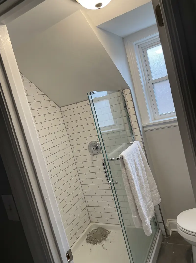 Just-finished walk-in shower in a small upstairs bathroom
