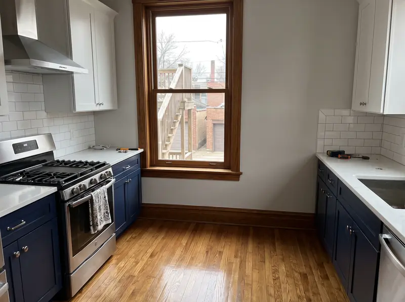 Navy and white kitchen remodel in a Chicago two-flat